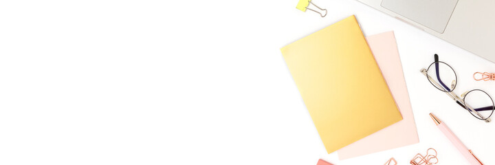 Banner with laptop and stationery on a white background. Workspace for homeschooling with place for text.