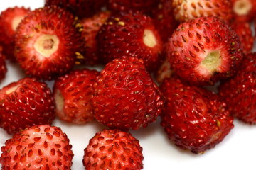 Wild strawberry isolated on white background closeup