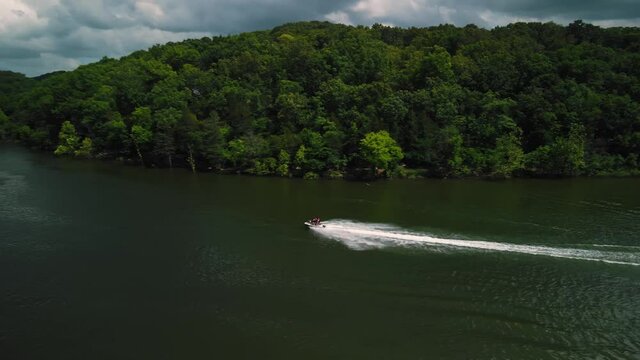 Aerial photography is an epic shot of jet ski racing on a large river. High quality 4k footage
