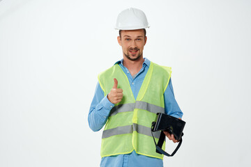 man in working uniform building vr glasses