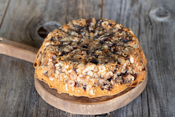 Chocolate and Hazelnut Cake on a wooden background. Close-up cake