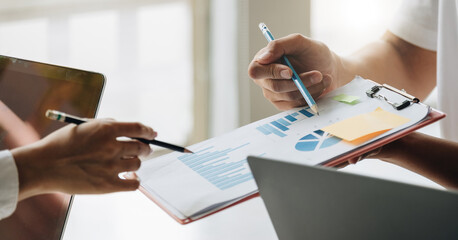 Close up team of young asian people discussing new business plan during a meeting in office