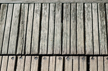 Fototapeta premium outdoor wooden floor, natural colored wooden strip, for walking, weatherproof, for coverings and walkways with joints and screws.