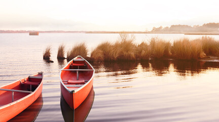 Kayak or canoe on a water front in the lake. Outdoors and adventure concept. vintage style. 