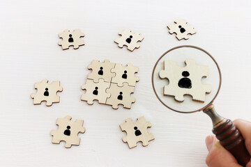 business concept image of puzzle blocks with people icons ,human resources and management concept