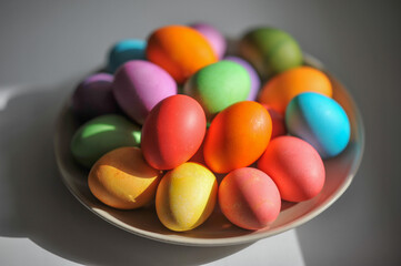 Traditional multicolored painted Easter eggs in a plate.
