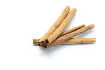 Top view of cinnamon sticks isolated on white