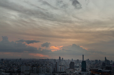 Bangkok, Thailand - Aug 08, 2021: Aerial view of Beautiful scenery view of Skyscraper Evening time Sunset creates relaxing feeling for the rest of the day. Selective focus.