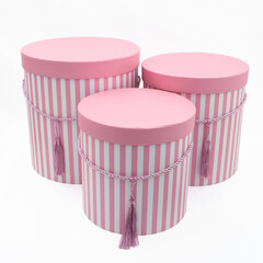 set of three yellow pink boxes with stripes isolated on white background