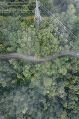 Mountain road in rainy and foggy day