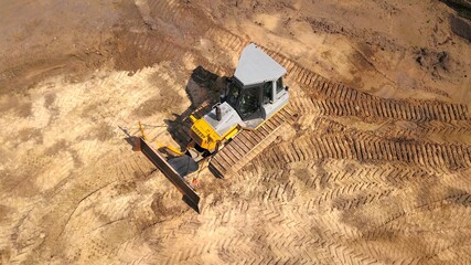 Bulldozer on a sandy construction site