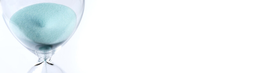 Hourglass on white background. Sand falls inside the flask.