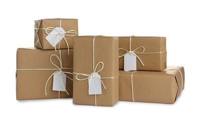 Parcels wrapped in kraft paper with tags on white background
