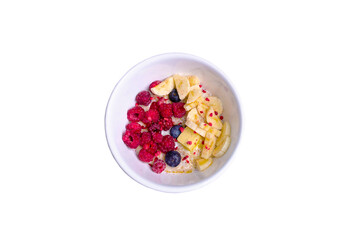 porridge with blueberries raspberries and banana on a white background
