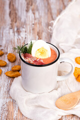 Spanish salmorejo cream soup with ham and egg