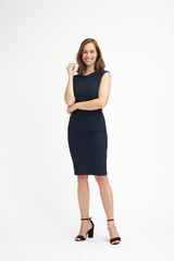 Full body portrait of a young businesswoman in black dress looking happy and confident - 451393706