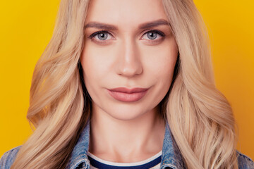 Close-up cropped portrait of blonde lady tempting look camera smile on yellow background