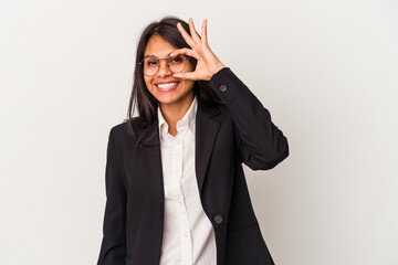 Young business latin woman isolated on white background excited keeping ok gesture on eye.