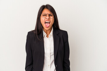 Young business latin woman isolated on white background screaming very angry and aggressive.