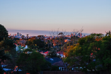 Panoramic view of Suburban Western and South Western Sydney housing, roof tops taken from a Park in Ashbury at Sunset NSW Australia