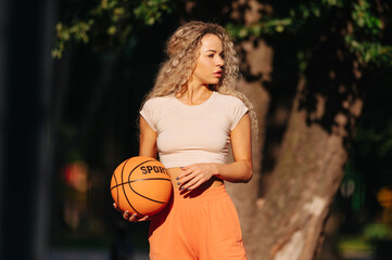 Portrait of young female basketball player. - Powered by Adobe
