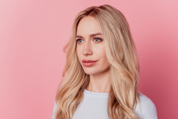 Naklejka premium Profile portrait of charming adorable lady look empty space on pink background