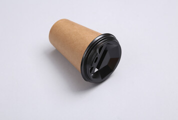 Craft coffee cup with lid on gray background