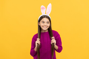 happy teen kid in bunny ears having fun on easter holiday, bunny hunt