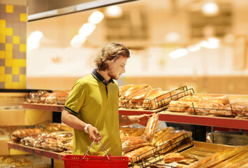 Man choosing bread from a supermarket.