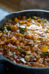 The steps for making winter melon tea, the winter melon grains and brown sugar are boiled in a pot