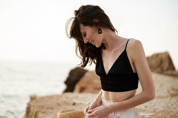 Fototapeta na wymiar Young smiling woman outdoors portrait at beach