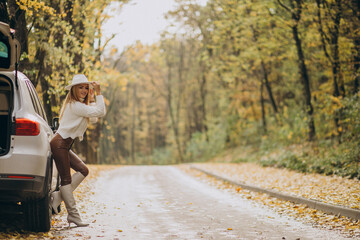Fototapeta premium Young pretty woman travelling by car