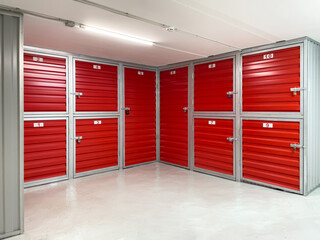 Storage corridor warehouse. Self storage facility, red metal doors with locks. Moving, organizing,...