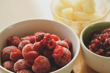 Frozen fruits, strawberries, raspberries, pineapples for smoothies or morning fruit juices. For the concept of health care, weight loss, healthy drinks