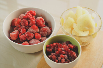 Frozen fruits, strawberries, raspberries, pineapples for smoothies or morning fruit juices. For the concept of health care, weight loss, healthy drinks