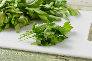 parsley leaves on cutting board - bright green - closeup