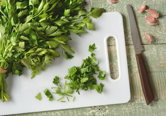 parsley leaves on cutting board - bright green - closeup