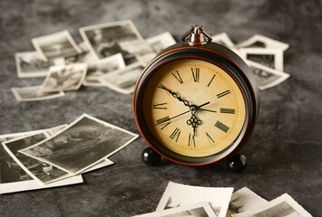 antique photo with old clock - memories of the past time - closeup