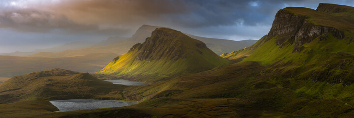 Dramatic mountains of the Isle of Skye seen from viewpoint on the Quiraing. Large panorama with...