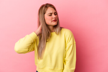 Obraz premium Young russian woman isolated on pink background having a neck pain due to stress, massaging and touching it with hand.