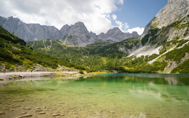 Idyllic alpine lake Seebensee, austrian alps, with view to mountain reflecting in the water. colorful summer landscape