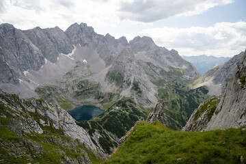 Fototapeta premium Panorama view of lakes Drachensee and coburger hut. Taken from mountain Tajakopf near Leermos ehrwald austria alps