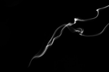 Smoke, clouds in a black background.