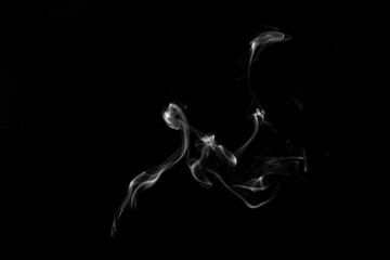 Smoke, clouds in a black background.