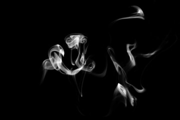 Smoke, clouds in a black background.
