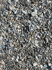 Pebbles or stones on the beach. 