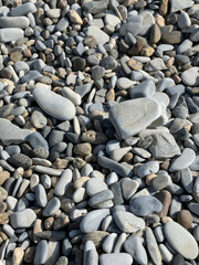 Pebbles or stones on the beach. 