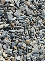 Pebbles or stones on the beach. 