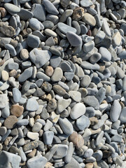 Pebbles or stones on the beach. 