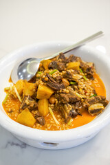 A delicious Chinese dish, braised short ribs with barley and potatoes